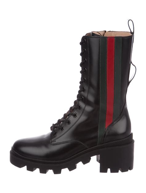 high top gucci boots.